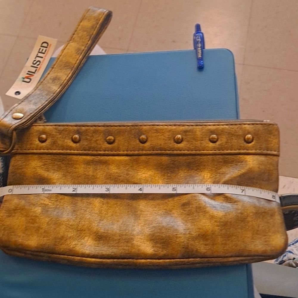Unlisted golden wristlet